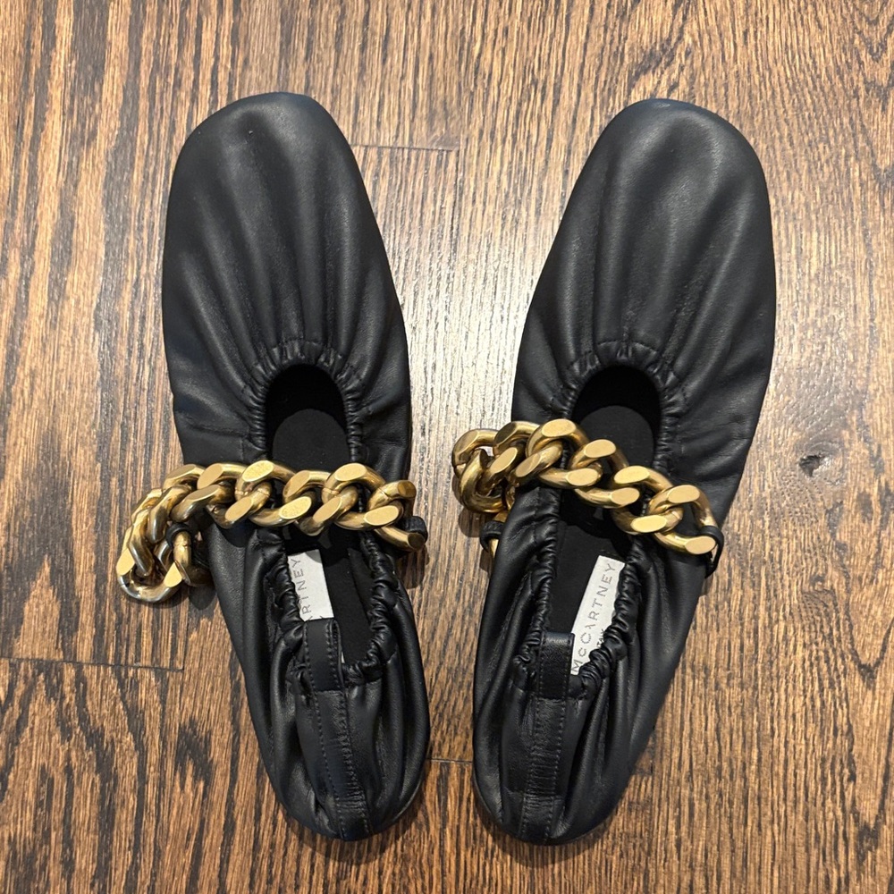 Stella McCartney Black Ballet Flats with Gold Chain. Lightly used. Size 38